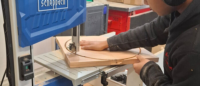 Apprentice sawing, manual work, vocational training